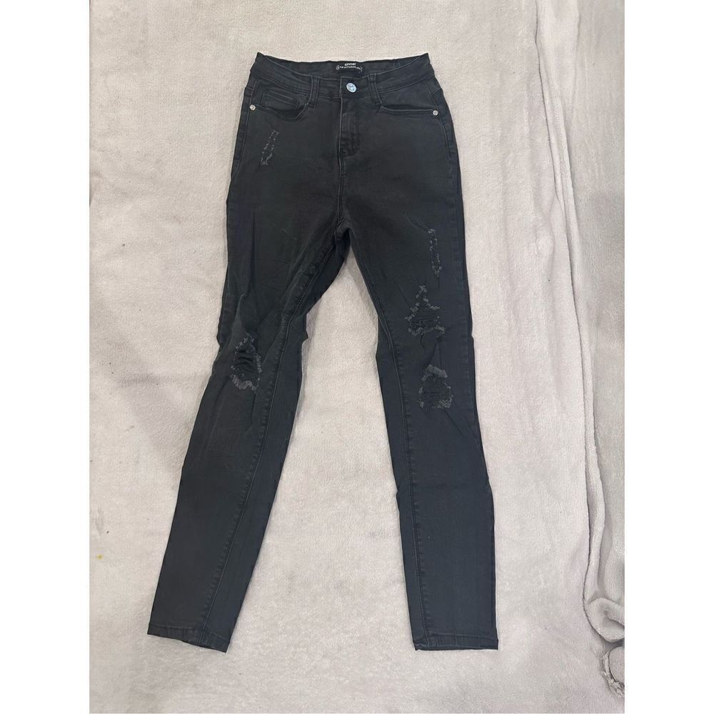 Women’s size 0 black jeans with rips from missguided